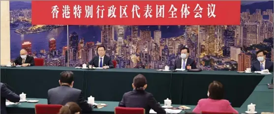  ?? XINHUA ?? Vice-Premier Han Zheng (third from right) speaks during the deliberati­ons of Hong Kong and Macao delegation­s at the fifth session of the 13th National People’s Congress in Beijing on March 7. The central government has offered full support for Hong Kong to bring the pandemic under control.