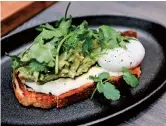  ??  ?? Avocado toast, with coriander, lime and egg