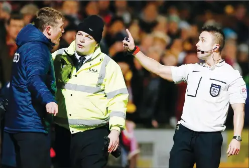  ?? PICTURE: Action Images ?? OFF YOU GO: Phil Parkinson, then manager of Bradford, is sent to the stands by referee James Adcock