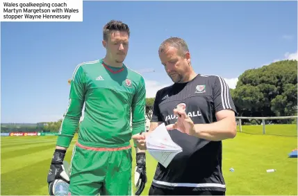  ??  ?? Wales goalkeepin­g coach Martyn Margetson with Wales stopper Wayne Hennessey