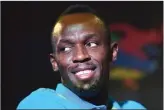  ?? JEWEL SAMAD/AFP ?? SESUMBAR: Sprinter Jamaika Usain Bolt dalam acara konferensi pers sebelum Racers Grand Prix di Kingston (8/6).