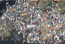  ??  ?? Activists gather near Union Station before marching to the Capitol. “I want to die of old age, not because of climate change,” said a 12-year-old Denver student.