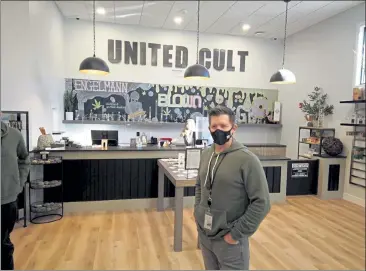  ?? COURTESY OF UNITED CULTIVATIO­N ?? United Cultivatio­n CEO Michael Spengler stands inside the newly opened cannabis dispensary in Ashby that he owns with his wife Carolyn Spengler and Danielle Phaneuf.