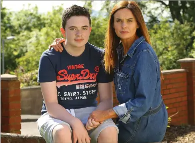  ??  ?? YOUNG SUFFERER: Sandra Blyth with Sam, 13, who is one of the youngest people in Scotland to have the condition. Picture: Colin Mearns