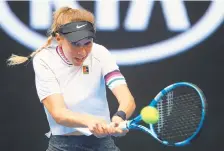  ?? JULIAN FINNEY/GETTY IMAGES ?? Amanda Anisimova plays a backhand in her match against Aryna Sabalenka.