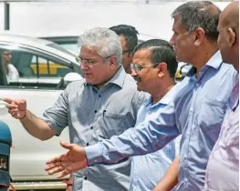  ?? — PTI ?? Delhi chief minister Arvind Kejriwal with transport minister Kailash Gahlot during a visit to the Automated Test Track at RTO office at Sarai Kale Khan in New Delhi on Thursday.