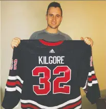  ?? ASHTON LOWRY ?? University of Regina Cougars alumnus Mitch Kilgore is shown with his Winnipeg Jets jersey before the Heritage Classic.