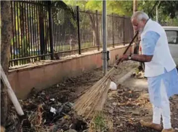  ?? — ASIAN AGE ?? Prime Minister Narendra Modi takes part in a cleanlines­s drive.