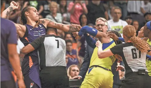  ??  ?? Mercury center Brittney Griner, left, and Wings forward Kayla Thornton, right, spar during Saturday’s game at Talking Stick Resort Arena in Phoenix. Griner and five others were ejected after the brawl. MADELEINE COOK / THE REPUBLIC