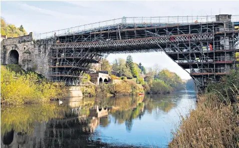  ??  ?? Restoratio­n of the 1779 bridge near Telford, Shropshire, is expected to cost £3.6 million. Its ironwork is cracking, partly due to an earthquake which occurred in the 19th century