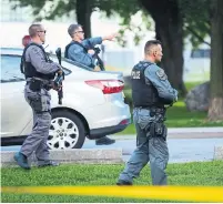  ?? VICTOR BIRO ?? Toronto police sealed off a large area of Coronation Park, across the street from the CNE, on Sunday for a homicide probe.