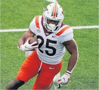  ?? GERRY BROOME/ASSOCIATED PRESS ?? While Virginia Tech has had to compensate for many players’ unavailabi­lity, Kansas transfer Khalil Herbert has become perhaps the nation’s best running back and has had the help of a dominant offensive line.