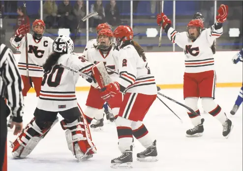  ?? Dave Stewart / For Hearst Connecticu­t Media ?? The New Canaan Rams begin their celebratio­n after winning the CHSGHA state championsh­ip with a 3-1 victory over Darien in the final at Bennett Rink in West Haven on Saturday.