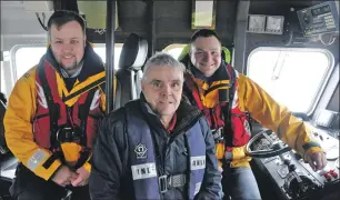  ?? 16_T06Lifeboa­t2 ?? Tom Kennedy, Billy Forteith and Richard Johnson aboard the Mora Edith MacDonald.