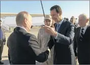  ?? Russian Presidenti­al TV ?? SYRIAN PRESIDENT Bashar Assad, right, warmly greets President Vladimir Putin upon the Russian leader’s arrival at the Hemeimeem air base in Syria.