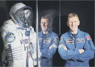  ??  ?? 0 Tim Peake takes a look at his spacesuit which is on display at the National Museum of Scotland