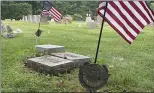  ?? SUBMITTED PHOTO — COURTESY OF BILL HENNING ?? A marker holds an American flag above the grave of a Korean War veteran buried in the Lansdale Cemetery on Tuesday.