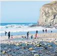  ??  ?? Beachcombi­ng in Porthtowan, Cornwall