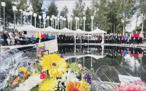  ?? PICTURES: PA. ?? REMEMBRANC­E: A floral tribute and card to Oran Doherty at an inter-denominati­onal service at the Memorial Gardens in Omagh to remember the Omagh bombing.