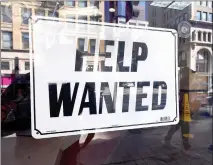  ?? Frederic J. Brown
/ AFP via Getty Images /TNS ?? In this photo from Feb. 4, 2022, a ‘help wanted’ sign is posted in front of a restaurant in Los Angeles.