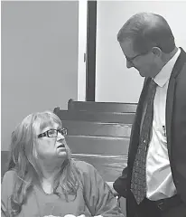  ?? Staff photo by Lynn LaRowe ?? Virginia Hyatt, 69, speaks with a member of her defense team, Texarkana lawyer Bruce Condit, before a hearing Friday afternoon in a courtroom at the Miller County jail. Hyatt is appealing her 2016 capital murder conviction for the 2013 murder of Patti...