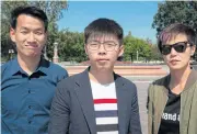  ?? AFP ?? Hong Kong pro-democracy activist Joshua Wong, centre, and Hong Kong Cantopop singer, Denise Ho, right, pose for a photo near the US Capitol in Washington on Saturday.