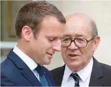  ?? — AFP ?? French President Emmanuel Macron speaks with French Foreign Minister JeanYves Le Drian after meeting with The Crown Prince of Abu Dhabi Mohammed bin Zayed al Nahyan at The Elysee Palace in Paris.