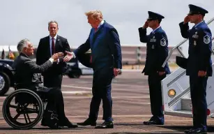  ?? Staff file photo ?? The White House under President Donald Trump, shown with Gov. Greg Abbott in 2018, extended a waiver on federal dollars for Medicaid. The Biden administra­tion is rescinding the extension.
