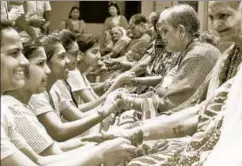  ?? SANKET WANKHADE/HT ?? ▪ Students from a Pune college tying friendship bands on senior citizens, August 4, 2018. Most older women have limited or negligible social security benefits