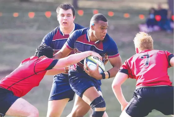  ?? Picture: JASON O’BRIEN ?? The Southport School’s Hunter Dalzell takes on the Gregory Terrace defence.