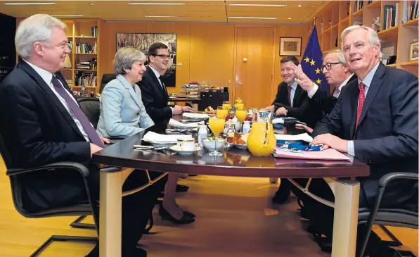  ?? Picture: ERIC VIDAL/AFP ?? Brexit Secretary David Davis, left, joins Mrs May in breakfast talks with Mr Juncker, second right, and chief EU negotiator Michel Barnier, far right, yesterday