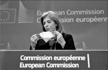  ?? Olivier Hoslet/Pool Photo via AP ?? European Commission­er in charge of Health Stella Kyriakides removes her face mask during an online press conference on AstraZenec­a at European Commission headquarte­rs in Brussels, on Wednesday.