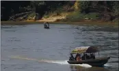  ?? EDUARDO VERDUGO — THE ASSOCIATED PRESS ?? Migrants cross the Usumacinta River on boats from Guatemala, to Frontera Corozal, Chiapas state, Mexico, Wednesday.