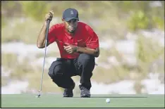  ?? GETTY IMAGES ?? For the oft-injured Tiger Woods (lining up a putt at the Hero World Challenge), any sign of pain-free movement is now greeted like a notable moment.