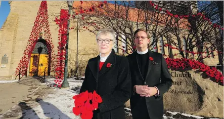  ?? LEAH HENNEL ?? Pippa FitzGerald-Finch and Rev. Leighton Lee say the poppies that adorn the Cathedral Church of the Redeemer have drawn attention.