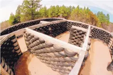  ?? SEAN M. HAFFEY/SAN DIEGO UNION ?? LEFT: An “Earth Ship” built by members of Heaven’s Gate on a former youth camp property near Mountainai­r.