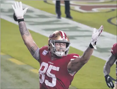  ?? PHOTOS BY TONY AVELAR — THE ASSOCIATED PRESS ?? San Francisco 49ers tight end George Kittle (85) celebrates after scoring a touchdown against the Eagles in Santa Clara on Sunday.