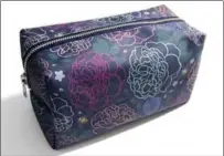  ??  ?? Travel bag, digitally printed onto 100 per cent cotton twill with cotton lining and aluminum zip closure, Elizabeth Attwood, $38.