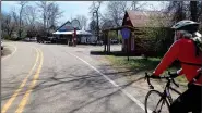  ?? NWA Democrat-Gazette/FLIP PUTTHOFF ?? Riders head into the town of Oark where the general store offers a good meal.