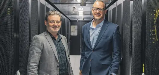  ?? ?? The University of Waikato’s Eion Hall and Spark’s Mark Beder announced the new partnershi­p at the university on Tuesday.