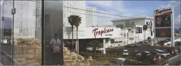  ?? JOHN LOCHER/AP ?? A PERSON, REFLECTED IN GLASS, WALKS NEAR THE TROPICANA LAS VEGAS, 2023, in Las Vegas.
Tuesday, May 16,