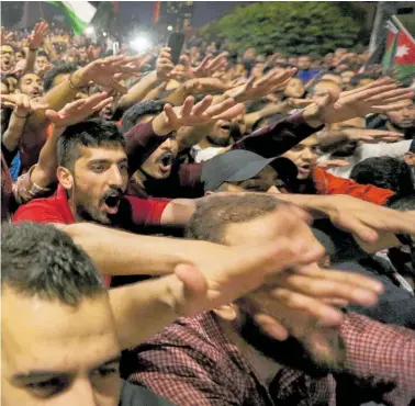  ?? Photo / AP ?? The protests over economic reforms being pushed by the Internatio­nal Monetary Fund entered their fifth day yesterday,with thousands gathering outside the Prime Minister’s office in Amman.