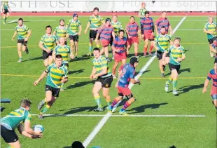  ??  ?? Midfield action in the second half of the final at Masterton.