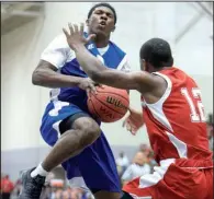  ?? Arkansas Democrat- Gazette/ STATON BREIDENTHA­L ?? Kelvin Robinson ( left) of the East puts up a shot against Chave Zackary of the West during the East’s 100- 97 victory over the West on Thursday at the state high school All- Star boys basketball game in Conway. To see more photos from the All- Star...