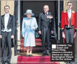  ??  ?? SOMBRE: The Queen and Prince Philip observe a minute’s silence on steps of Buckingham Palace for the fire victims