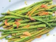  ?? MELISSA D’ARABIAN VIA AP ?? Quick-sauteed asparagus with a soysauce glaze is a dish from a recipe by Melissa d’Arabian.