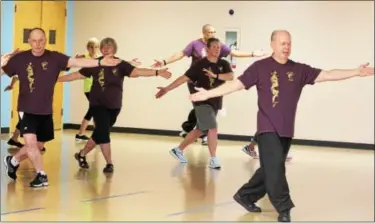  ?? DIGITAL FIRST MEDIA FILE PHOTO ?? Charles Brynan, of Pear Garden Tai Chi & Reflexolog­y, far right, leads a tai chi class at the Pottstown YMCA. The Philadelph­ia Freedom Valley YMCA has announced that it will close its Pottstown branch in June 2018, citing $11 million in repairs that...