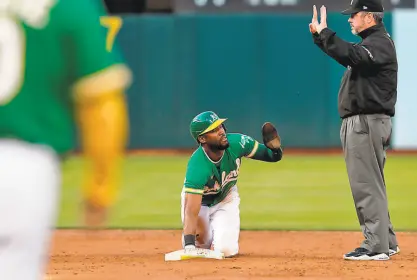  ?? Carlos Avila Gonzalez / The Chronicle ?? The A’s Starling Marte calls for time after stealing second against the Padres on Tuesday night. Marte has 27 stolen bases in 69 games, second most in the majors entering play Thursday.