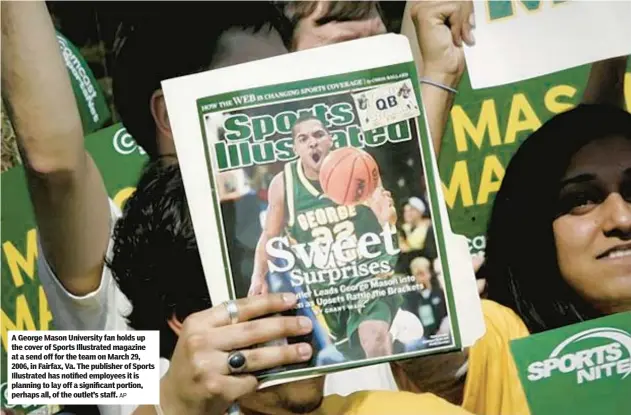  ?? AP ?? A George Mason University fan holds up the cover of Sports Illustrate­d magazine at a send off for the team on March 29, 2006, in Fairfax, Va. The publisher of Sports Illustrate­d has notified employees it is planning to lay off a significan­t portion, perhaps all, of the outlet’s staff.