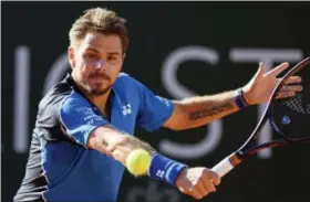  ?? MARTIAL TREZZINI — KEYSTONE VIA AP ?? Switzerlan­d’s Stanislas Wawrinka returns a ball to Marton Fucsovics of Hungary in their quarterfin­al match during the Geneva Open tournament in Geneva, Switzerlan­d, Thursday.